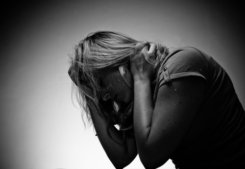 Sad Woman Sitting Alone © Bewuel