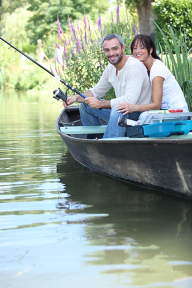 Couple Fishing on a Boat in the River © Auremar.jpg