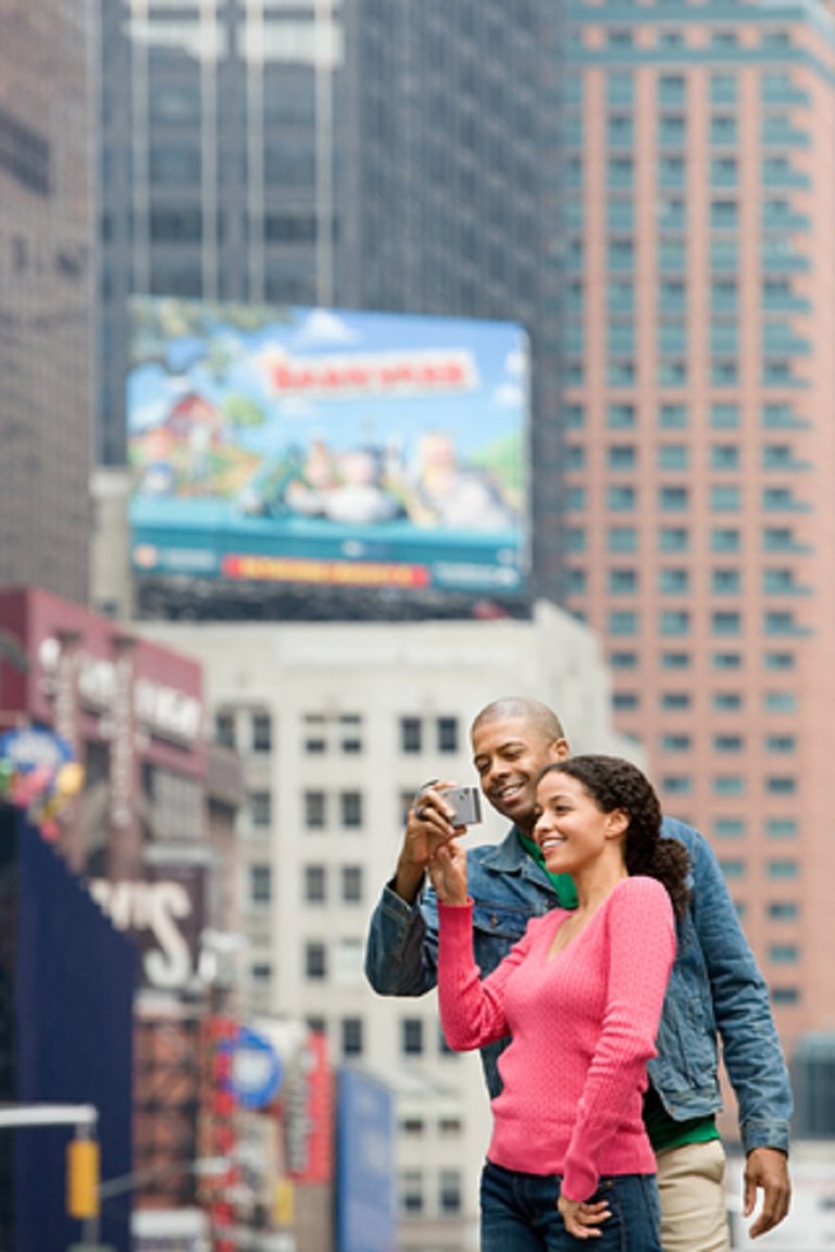 Cute Couple Using Digital Camera - © Xixinxing
