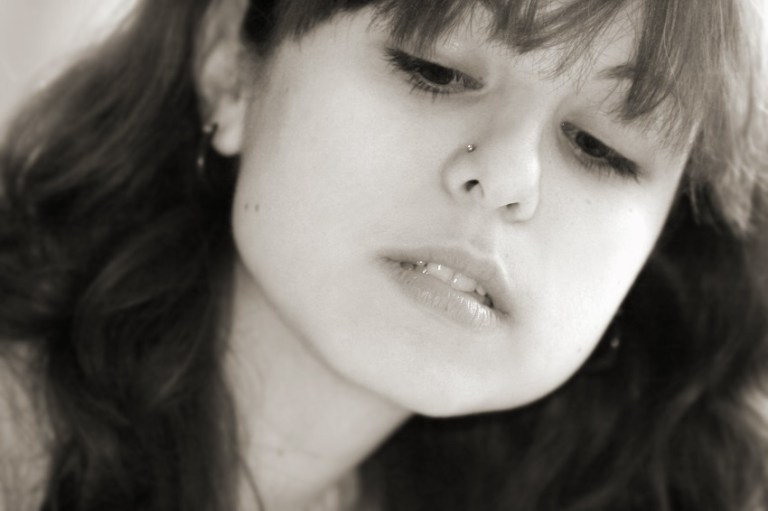 Teen Girl Looks Down - © Galina Barskaya