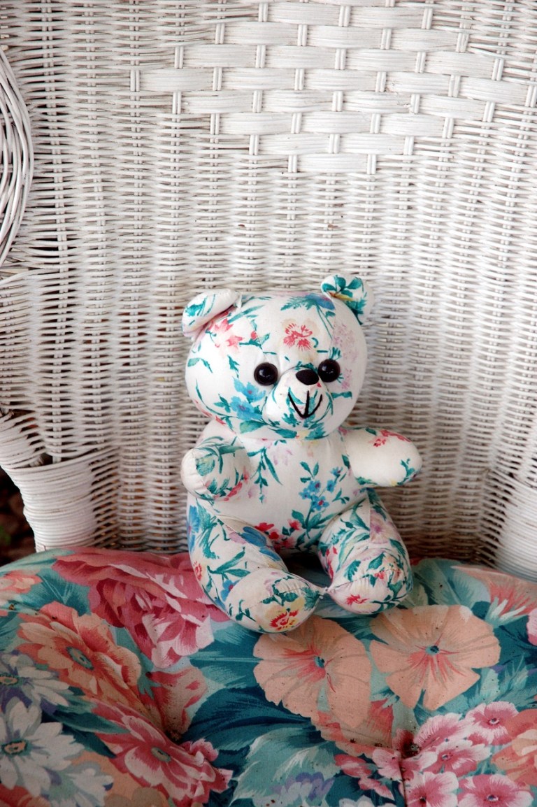 Stuffed Bear In a Wicker Chair © Photoeye